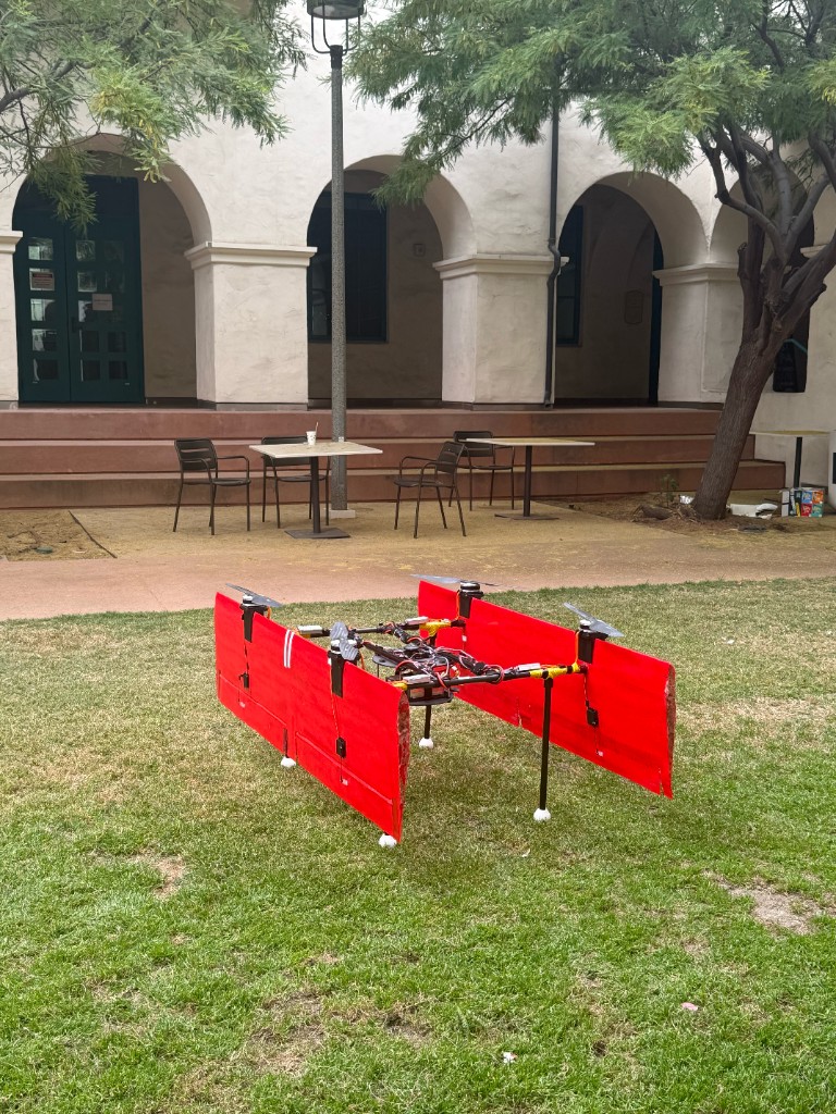 Completed Quetzal VTOL with red side panels on grass outdoors